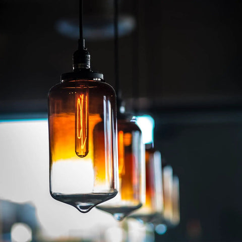 Dimmable T10 Amber LED Tubular Bulb 6W 60W Equivalent, Retro Edison Style Light glowing in glass pendant, warm ambiance