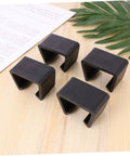 Four Pack Sturdy Chair Clips For Rattan Furniture, Sofa Fasteners And Corner Connectors on wooden surface