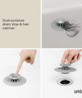 Dual Purpose Silicone Shower Drain Stopper And Hair Catcher Kills Sticky Pipe Buildup, 3 inch diameter in sleek grey with hair caught.