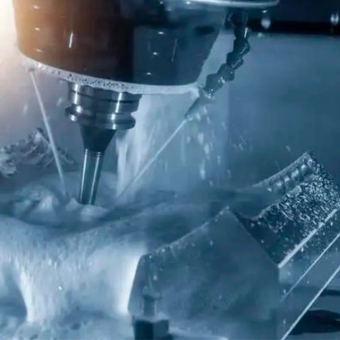 Morse taper drill chuck mounted on milling spindle with drill bit and coolant spray