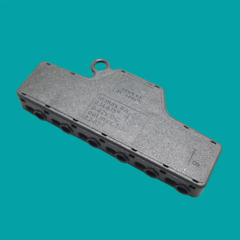 Solid Build And No Sweat Wiring 1 In 6 Out Led Strip Light Terminal Block Splitter with push-in connectors on a gray background.