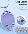 Close-up of a purple 5 Pack LED Keychain Flashlights, 12 Lumen Mini Pocket Lights For Outdoor Work Camping And Hiking with batteries