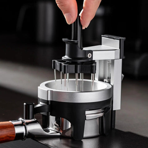 Heavy Hitter Rotary Espresso Puck Distributor Tool Featuring Adjustable Height And 12 Precision Points To Crush Clumps in use.