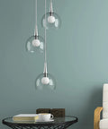 Modern living room with glass pendant lights, featuring G25 LED Vanity Bulbs 450 Lumens 2700K Soft White Light Non Dimmable.