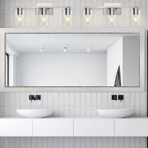 Three Light Vanity Wall Light in Brushed Nickel for Bathroom Over Mirror, shown installed above white sinks