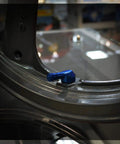Installed Angled Valve Stem Set With Pre Applied Threadlocker Nut Forged Aluminum Construction 0.357 Inch (8.3mm) Size Blue Finish