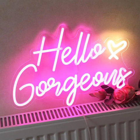 Pink LED Neon Sign Hello Gorgeous For Home Decor And Party Backdrops glowing on wall, 16.5x10.6 inches, USB powered