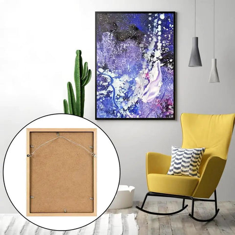 Ultimate Picture Hanging Kit With 100 Feet Braided Wire 60 D Ring Hangers in modern room with abstract canvas
