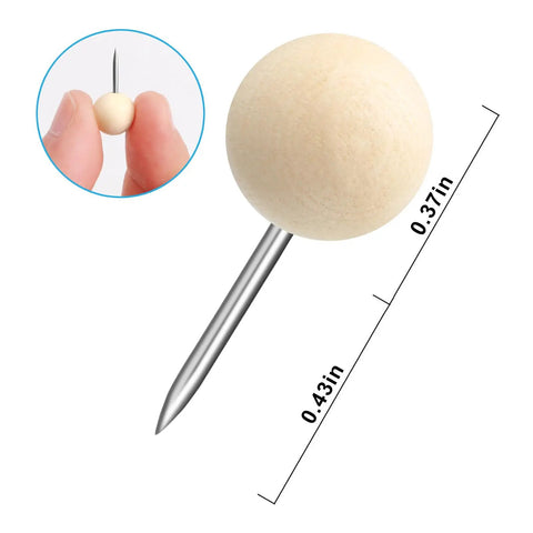 Top Shelf Wooden Push Pins, 120 Pack Of Straightforward Thumb Tacks For Corkboards And Bulletin Boards, Crafted With Rock Solid Wood Caps And Keen Steel Points, close-up of a wooden push pin with steel point.