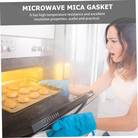 Person using microwave with 10 Piece Mica Plate Sheets For Microwave Oven Heat Insulation Cover And Waveguide Accessories.