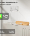 Cordless Wall Sconces Pair charging on a table, showcasing USB-C port and 5000mAh battery for easy setup.
