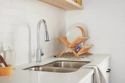 High Arc Pull Down Kitchen Faucet With 3 Function Sprayer And POWERinse Technology installed in modern kitchen, chrome finish.
