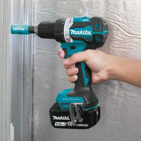 Top Shelf Compact 18V LXT Brushless Cordless Driver Drill Kit With 5Ah Lithium Battery, being held against metal surface.