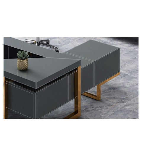 Solid As A Rock L Shaped Desk With Blue And Gold Finishes Heavy Duty Executive Computer Table Workhorse For Modern Home Office Setup Featuring Deep Drawer And Level Base close-up of gray desk with gold accents and succulent.