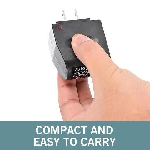 Built Tough AC To DC Car Converter Outlet 12 Volt 500mA Cigarette Lighter Socket Adapter held in hand, compact design, easy to carry.