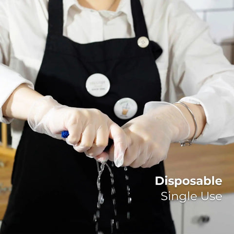 Person wearing Large 1000 Count Clear Vinyl Disposable Gloves Powder Free Great Fit Tear Resistant Multi Purpose For Cooking Food Prep And Janitorial DINP Free Ambidextrous Comfortable Grip, twisting a wet cloth.