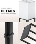 Detailed view of Three Tier Floor Lamp With Shelves For Living Room Black Finish With 11W LED Bulb And Dual USB Ports Plus A Power Outlet Perfect For Bedroom Or Lounge Slim Sturdy Shelving And Modern Lighting, featuring linen shade, cord clamps, and anti-slip cushions.