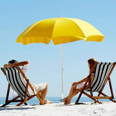 Universal Beach Umbrella Sand Anchor With 5 Spiral Screw Design in use with yellow umbrella on beach with two chairs