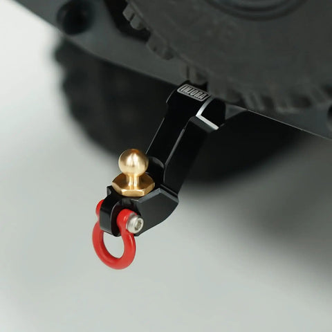 Aluminum Drop Hitch Receiver for 1 By 18 RC Crawler Upgrade Part with red tow hook and gold ball joint attached to RC vehicle.
