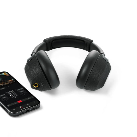 Dope Tone Wired Smart Guitar Headphone Amp With Custom Audio Drivers Noise Isolation Bluetooth Streaming And AI Powered App For Electric Acoustic And Bass Guitars next to smartphone app display showing sound settings.