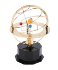Gold Tone Solar System Model Decoration With Iron And Plastic Grand Orrery on a black base, featuring colorful planets.