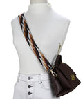 Wide Adjustable Jacquard Purse Strap For Women With Gold Hardware Thick Woven Crossbody Bag Replacement Strap In Leaf Brown Straight Fire Everyday Essential worn over a white top with a brown handbag.