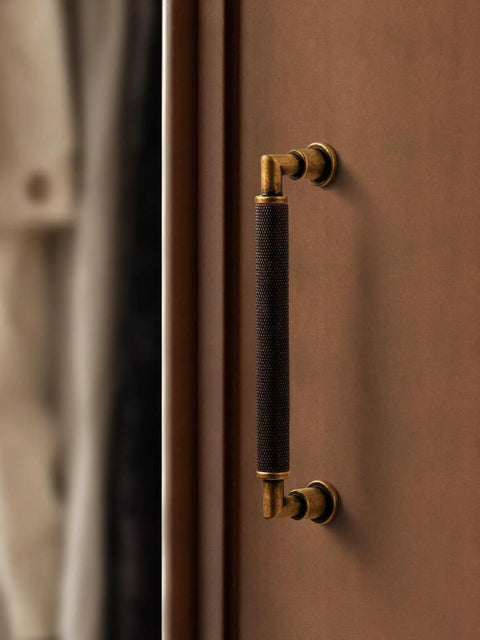 Antique Brass Cabinet Pulls 5 Pack 5 Inch Center Hole Knurled Retro Drawer Handles on a wooden cabinet.