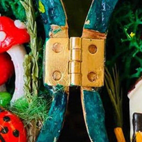 Close-up of a single brass butt hinge installed on a colorful decorative item, part of the Ten Pack 1 Inch Brass Butt Hinges With Screws For Cabinets Drawers And Jewelry Boxes DIY Friendly Durable Solid Brass Rust Proof Easy Install Heavy Duty Hardware Kit By Quweiz.