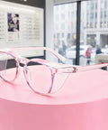 Women Anti Fog Safety Glasses Featuring Crystal Clear Protective Vision And Scratch Resistant Shields Built For Outdoor Cycling And Daily Tasks Delivers Zero Haze Clarity and smooth featherlight comfort displayed on a pink pedestal.