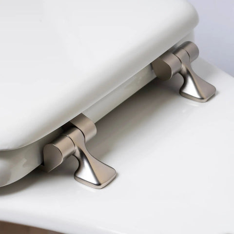 Close-up of brushed nickel hinges on an Elongated White Toilet Seat With Brushed Nickel Hinges That Never Loosens Stays Put And Secure Easy Install Durable Comfort Upgrade For Your Bath Fits Most Standard Toilets showing secure fastening.