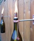 Wine bottle torches on fence using 12 Pack Fiberglass Replacement Wicks For Tiki Torches And Wine Bottle Torches Outdoor Patio Lighting Lanterns And Oil Lamps Long Burning Odorless Trimable