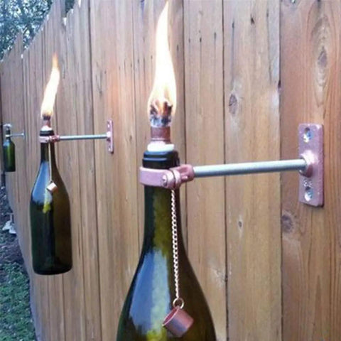 Wine bottle torches on fence using 12 Pack Fiberglass Replacement Wicks For Tiki Torches And Wine Bottle Torches Outdoor Patio Lighting Lanterns And Oil Lamps Long Burning Odorless Trimable