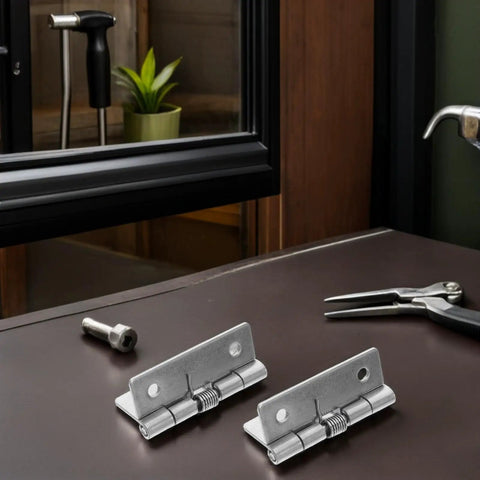 Hardcore Stainless Steel Self Closing Hinges on a table with tools, suitable for coastal climates and rust proof.