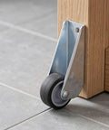 5pcs Wooden Gate Wheel Side Mount Caster with 1.5 Inch Rubber Rollers mounted on wooden furniture leg.
