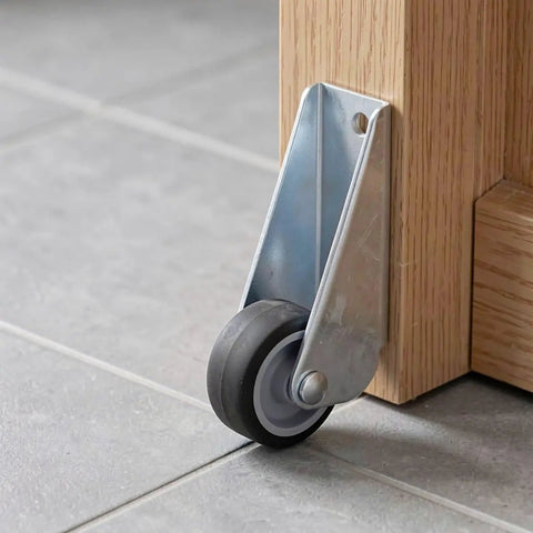 5pcs Wooden Gate Wheel Side Mount Caster with 1.5 Inch Rubber Rollers mounted on wooden furniture leg.