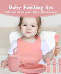 Child using Silicone Baby Feeding Set 13Pc Kit With Suction Bowl Plate Spoons Forks Bib Cup Toothbrush LED Weaning Supplies Pink