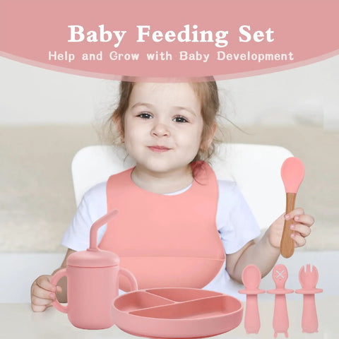 Child using Silicone Baby Feeding Set 13Pc Kit With Suction Bowl Plate Spoons Forks Bib Cup Toothbrush LED Weaning Supplies Pink