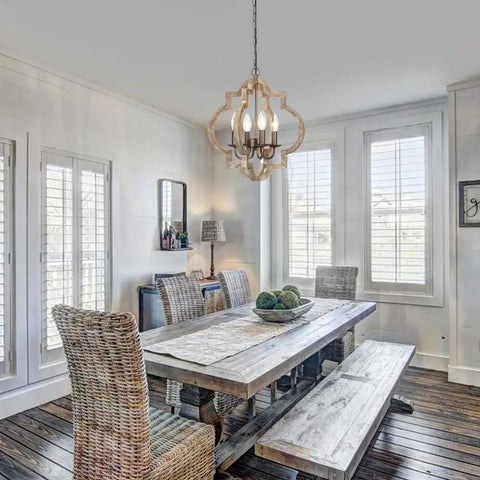 Dining room with Orb Farmhouse Chandelier 4 Light Handmade Wood Rustic Vintage Pendant For Dining Room Living Room Foyer Bedroom Kitchen Island Entryway Cozy Country Vibe 15.7 Inch Diameter hanging above a rustic table.