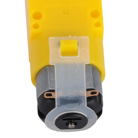 Front view of yellow Mecanum wheel module for geared motor with rubber-coated wheel and translucent mounting clip