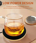 Portable Cup Warmer And Coffee Mug Heater With Smart Thermostatic Control To Keep Your Daily Brew Piping Hot On Any Desk Lightweight Plastic Build Super Handy For Home Office Or Dorm Life Must Have with glass mug on coaster.