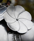 Close-up of Steel Rondels Besagews For Medieval Armor 14 cm round disc with brown leather straps, flower-shaped design.