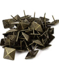 Badass Bronze Upholstery Tacks 50 Pack Square Head Bubble Nails For Furniture Crafting Decorative Thumb Tacks With Vintage Polish Solid Heavy Duty Hardware For Diy Cabinetry That Looks Absolutely Dope, close-up view of antique bronze tacks.
