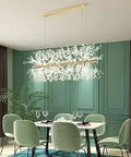 Crystal Modern Chandelier With K9 Beads And Firework Gold Finish A Showstopper Piece For Living Room Dining Room Kitchen 12 Light Fixture Large 36 Inch Starburst Ceiling Light hanging over a dining table.