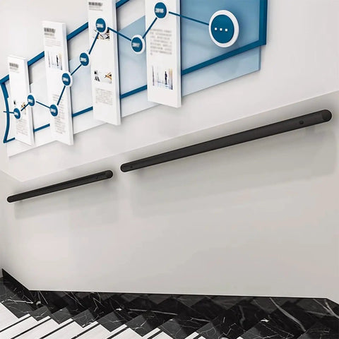 Slick Black Stainless Steel Railing Indoor And Outdoor Heavy Duty Wall Guardrail With Built Tough Foot Support For Stairs And Decks Corrosion Resistant Top Shelf Home Upgrade Kit mounted on a wall near stairs.