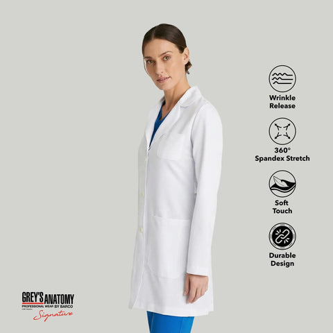 Woman wearing Women's 3 Pocket Lab Coat 32 Inch White 3X Large Soft Touch Fabric tailored for nurses with finished seams.