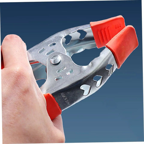 Heavy Duty Metal Spring Clamps With Ergonomic Handles Built Tough For Woodworking Carpentry And Model Making Red Coated Shop Essentials held by hand
