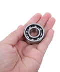 Chainsaw Crankshaft Bearing And Rubber Oil Seal Set For High Speed Transmission, Needle Roller Bearing Kit, Saw Repair For Gasoline Power Saws, Heavy Duty Pro Grade Sealing System For Tight Seal And Leak Free Performance. steel bearing in hand