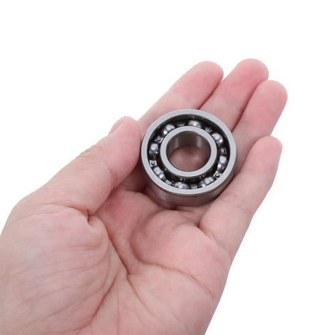Chainsaw Crankshaft Bearing And Rubber Oil Seal Set For High Speed Transmission, Needle Roller Bearing Kit, Saw Repair For Gasoline Power Saws, Heavy Duty Pro Grade Sealing System For Tight Seal And Leak Free Performance. steel bearing in hand