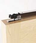Close-up of a 60 Inch Bifold Door Hardware Kit For Four Doors Top Mounted Sliding Barn Style Rails And Rollers, steel track on wood panel.