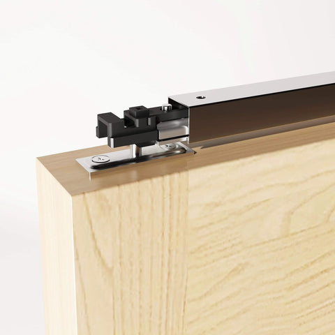 Close-up of a 60 Inch Bifold Door Hardware Kit For Four Doors Top Mounted Sliding Barn Style Rails And Rollers, steel track on wood panel.